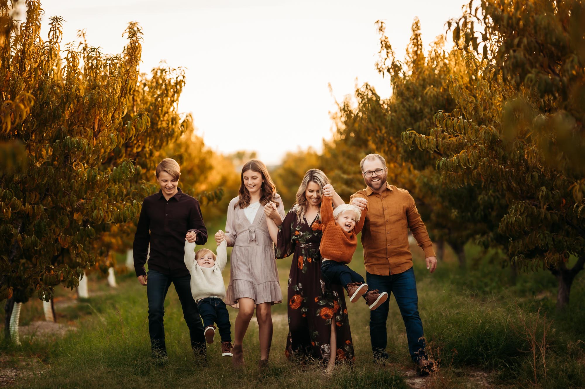 Family Pictures in East Texas | Family Playing in Orchard in Fall