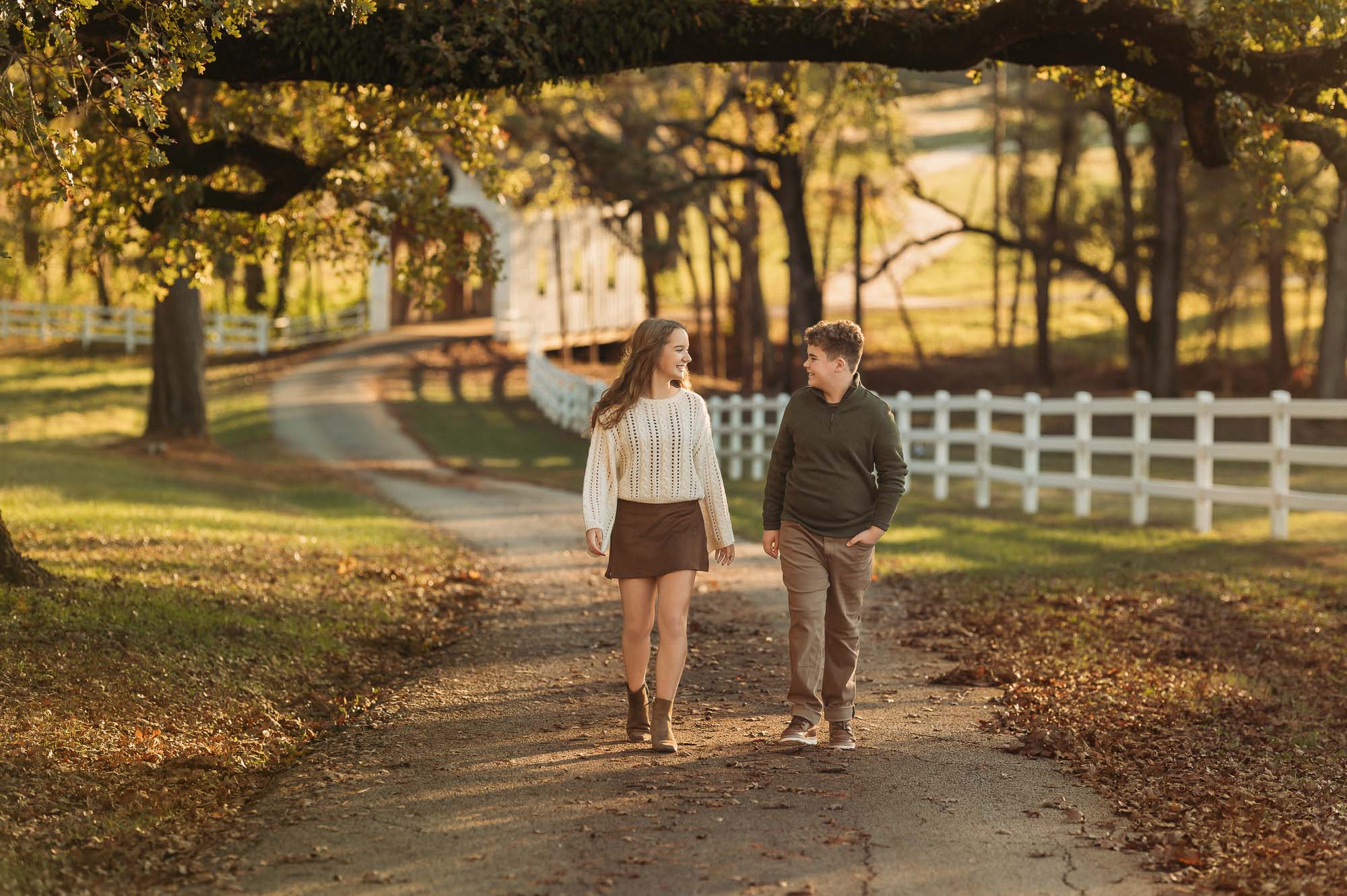 Portrait of siblings walking down road in fall | Flint Texas Family Photographer
