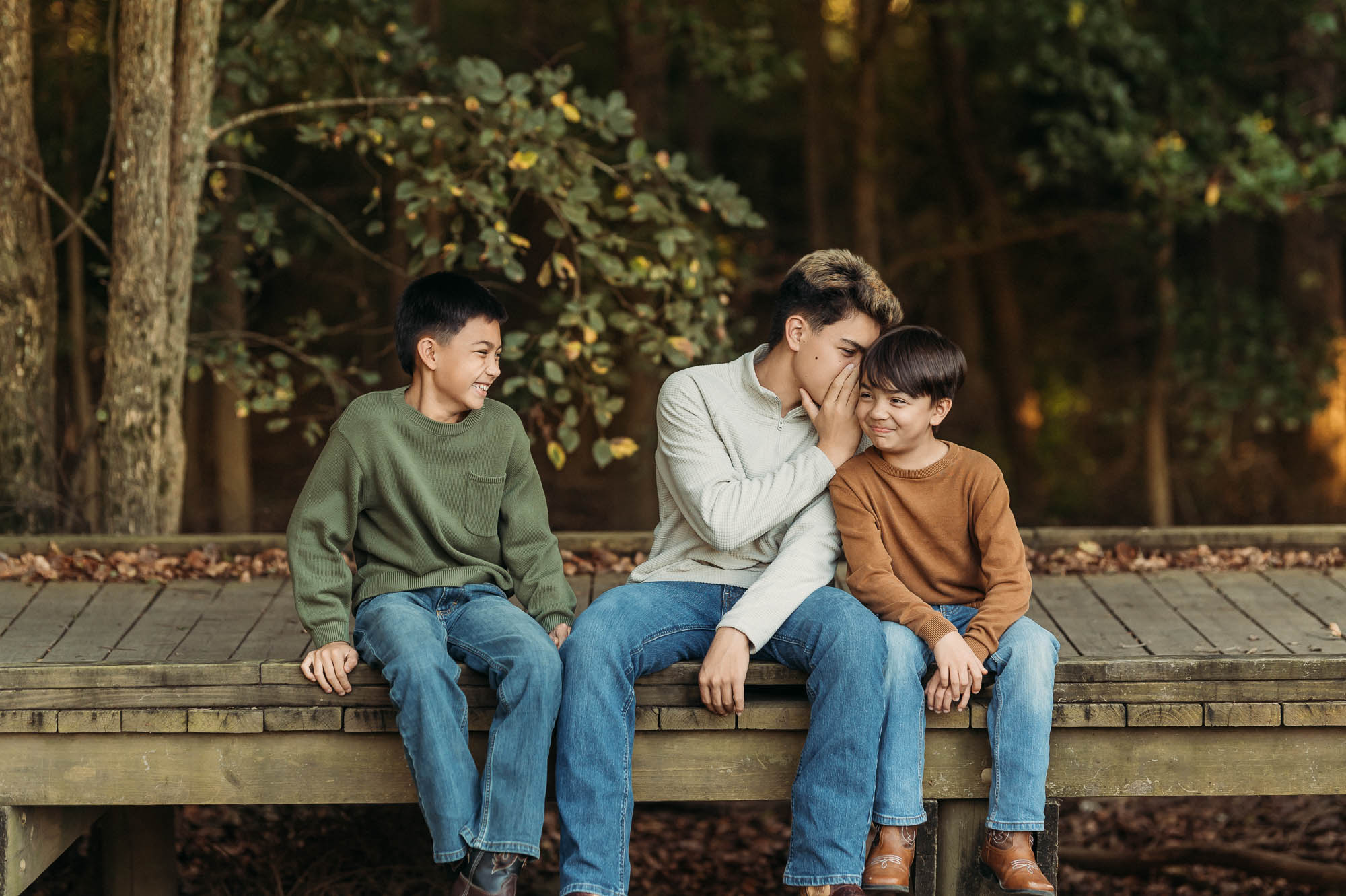 Brothers whispering secrets on a bridge | Family Session in Tyler TX