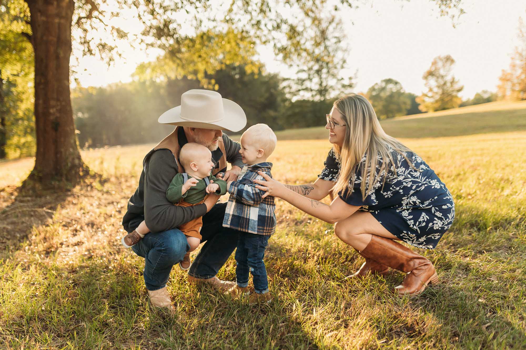 family playing under tree at Mineola Nature Preserve | Mineola TX Family Photographer