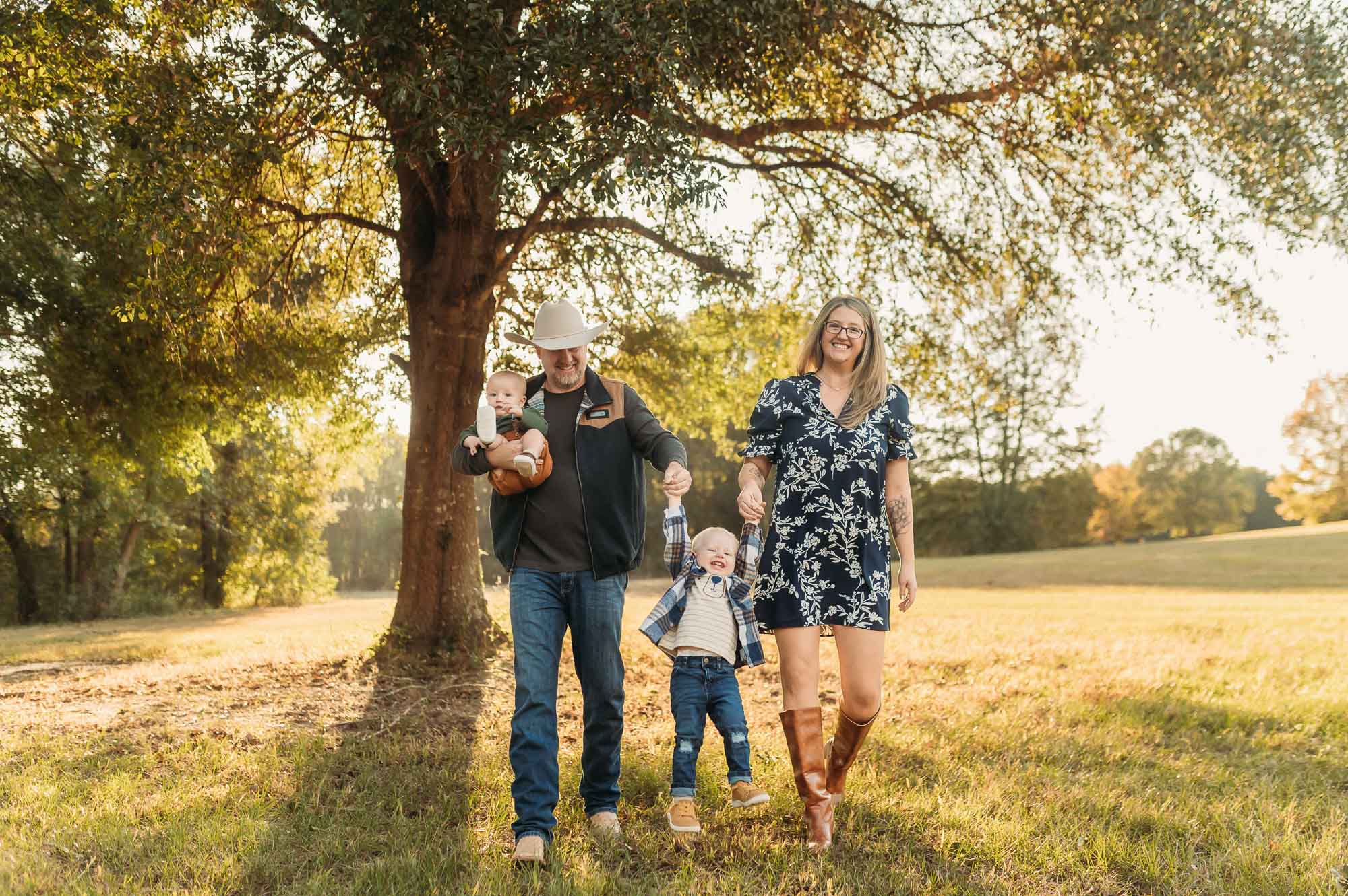 family playing under tree at Mineola Nature Preserve | Mineola TX Family Photographer