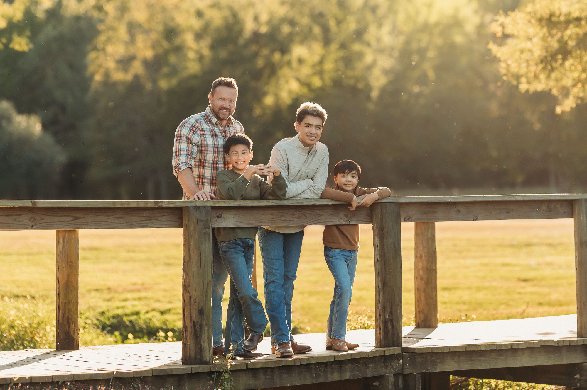 Dad and sons on a bridge in East Texas | Family Session in Tyler TX