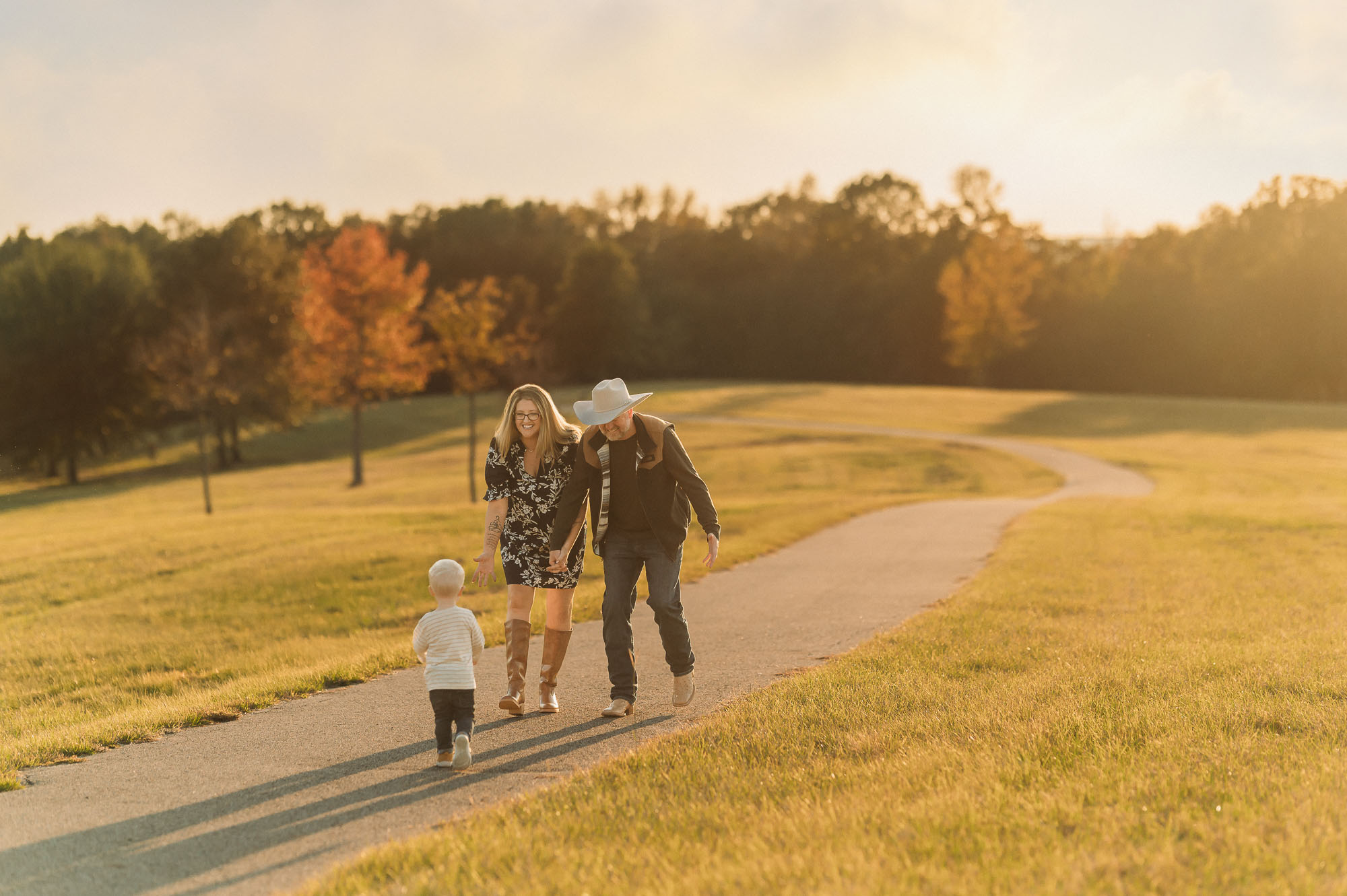 family waking down path at Mineola Nature Preserve | Mineola TX Family Photographer