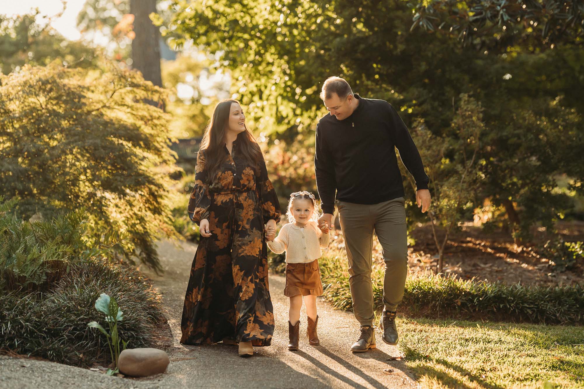 Family walking down path in Tyler Rose Garden | Tyler Texas Family Photographer