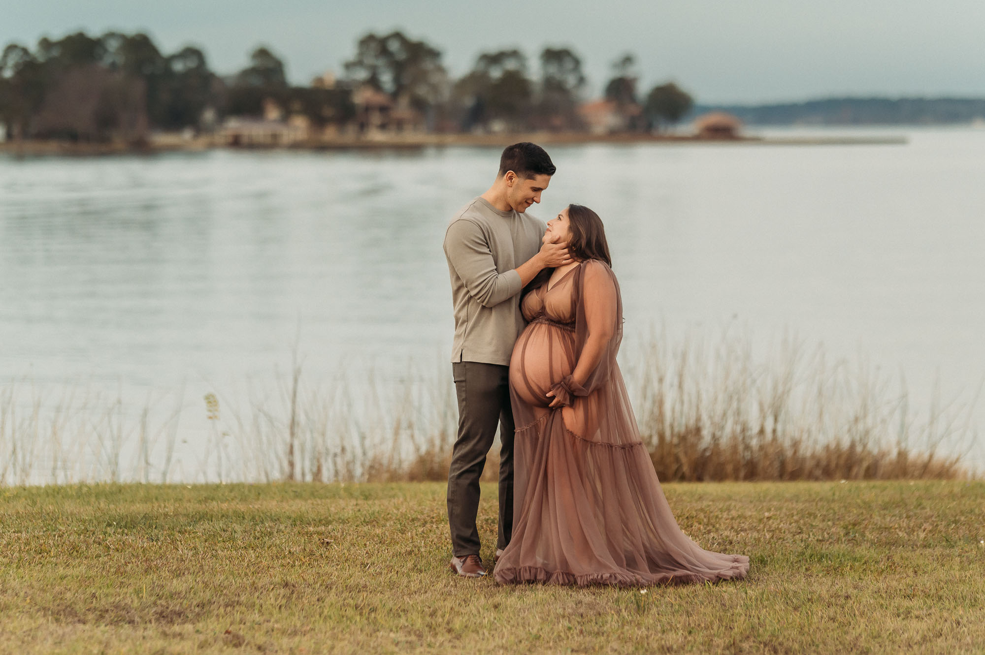 Expecting couple standing by Lake Tyler | Tyler Texas Maternity Photographer