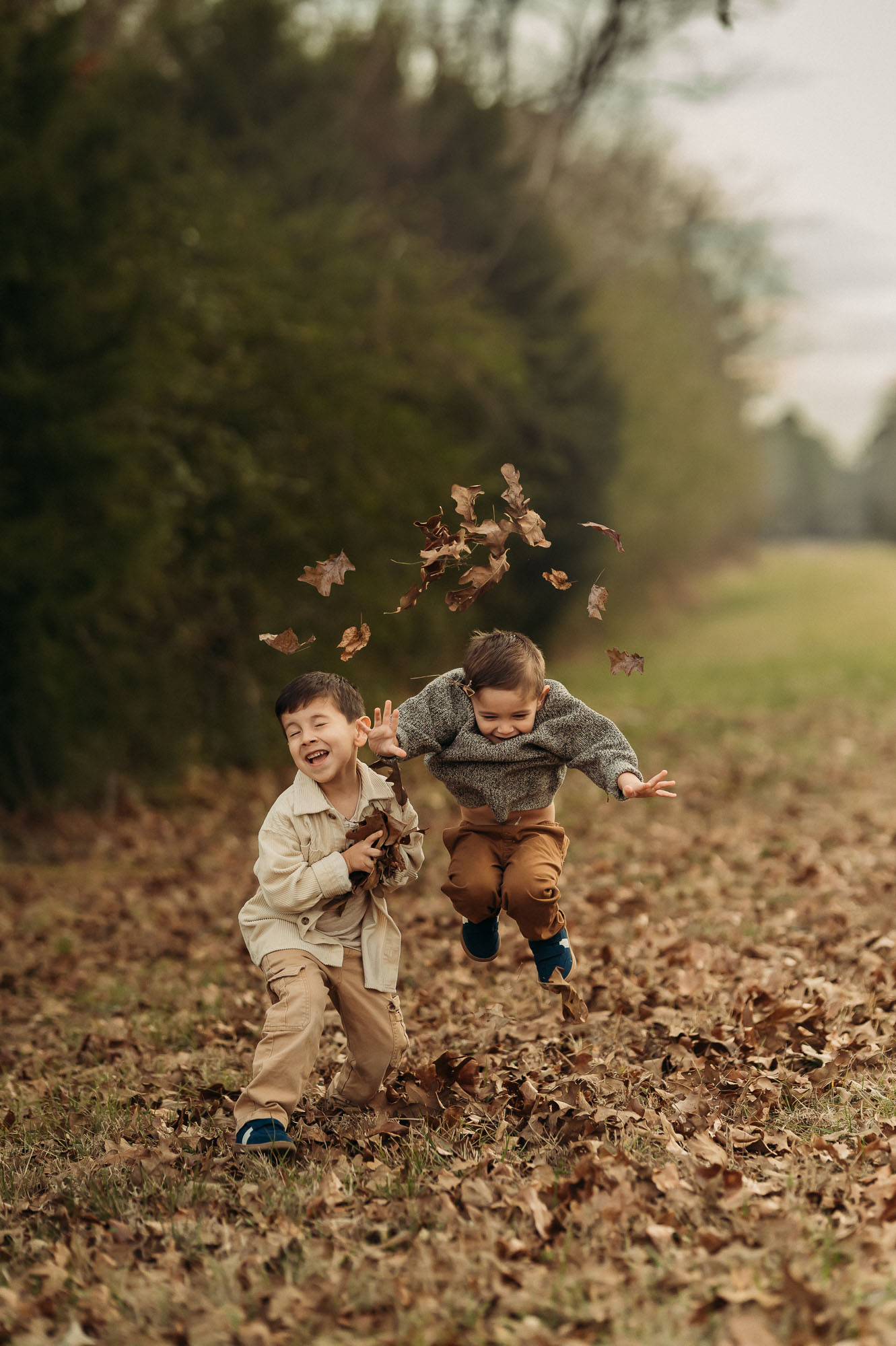 Boys playing in fall leaves | Tyler Texas Maternity Photographer