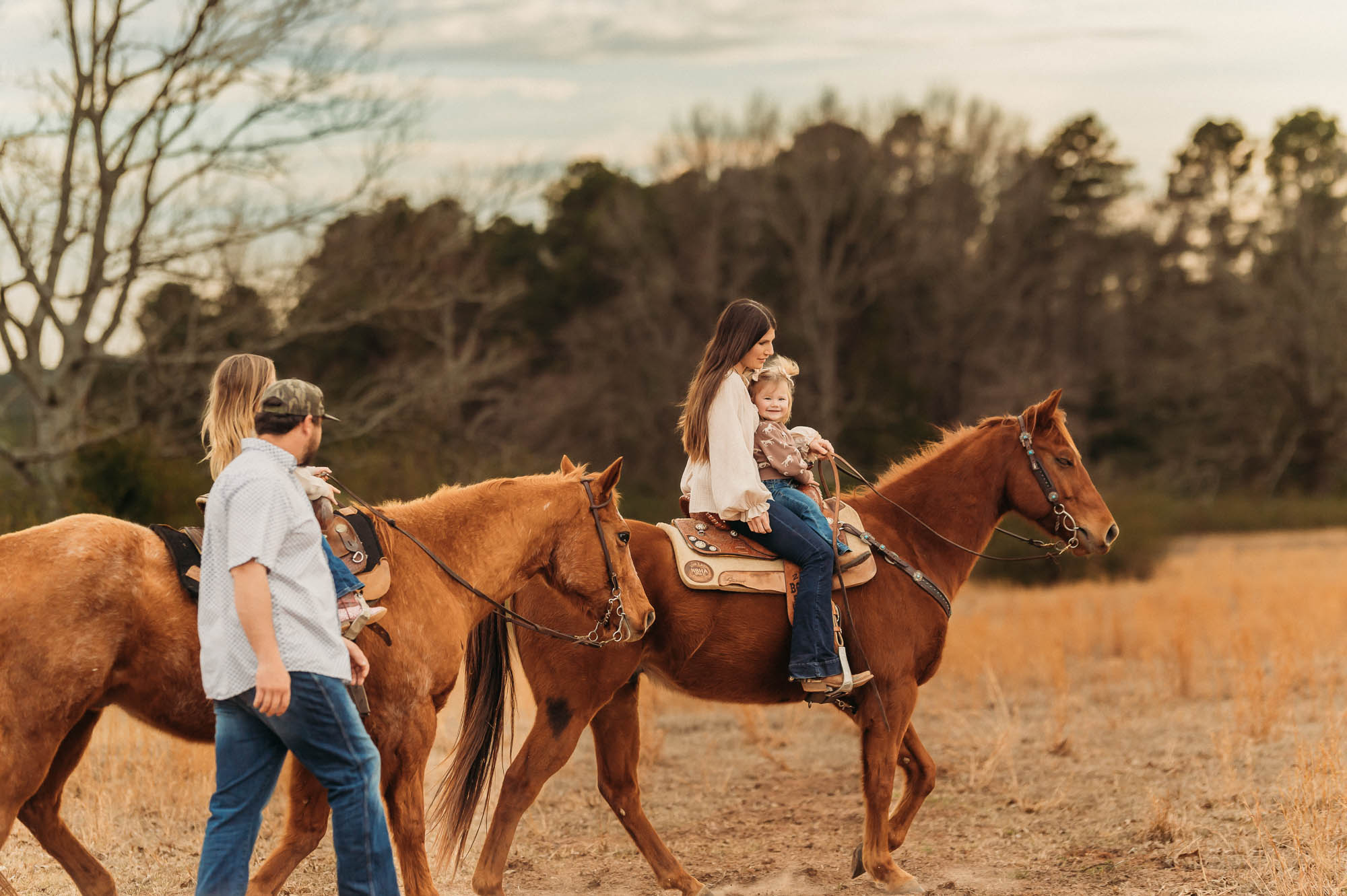 Family Riding Horses in an open meadow | East Texas Equestrian Family Photographer