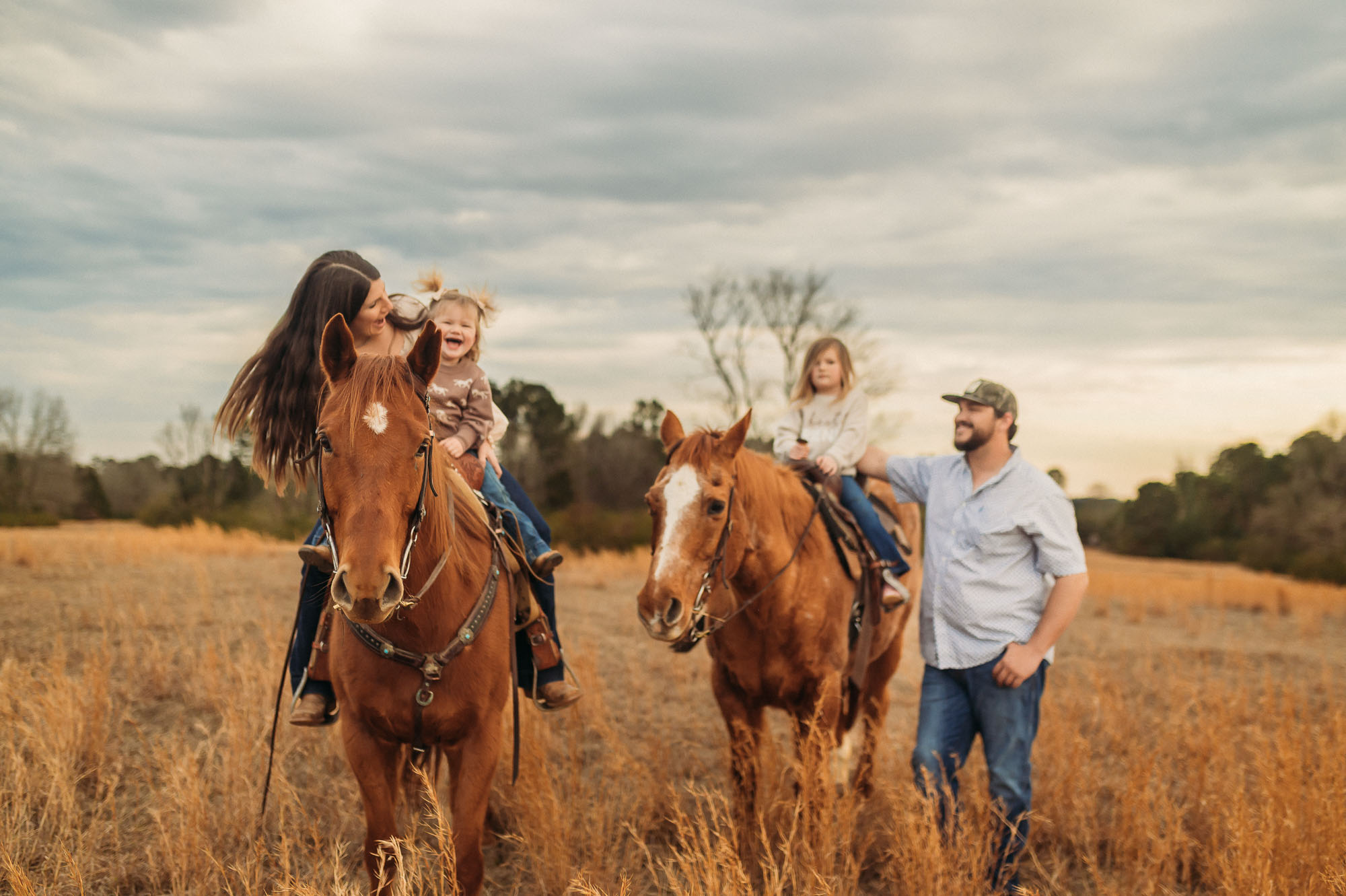Family Riding Horses in an open meadow | East Texas Equestrian Family Photographer