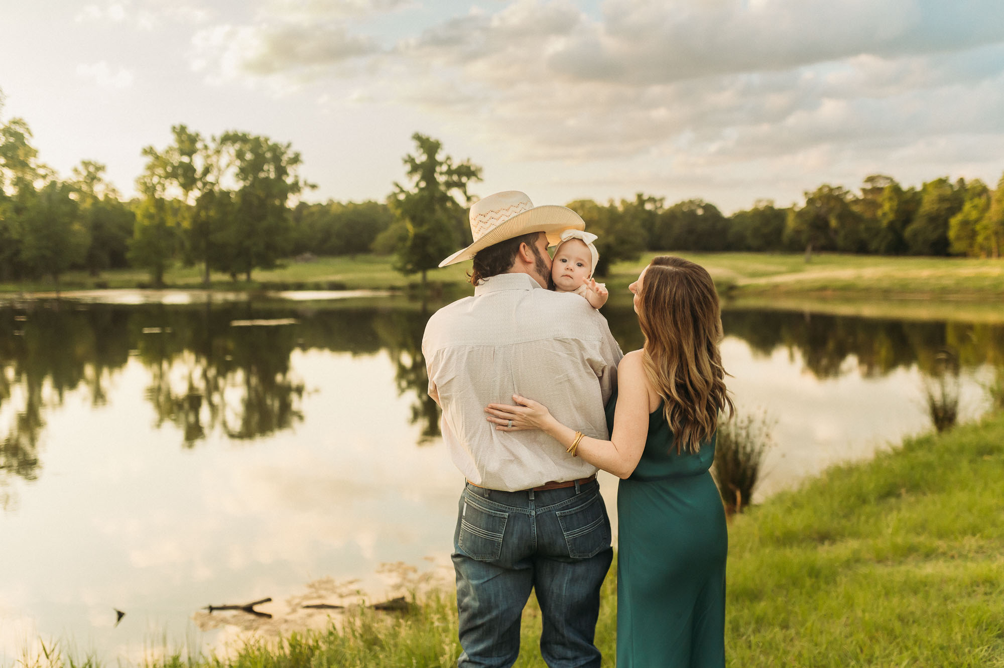a family portrait by a pond | East Texas Lifestyle Photographer