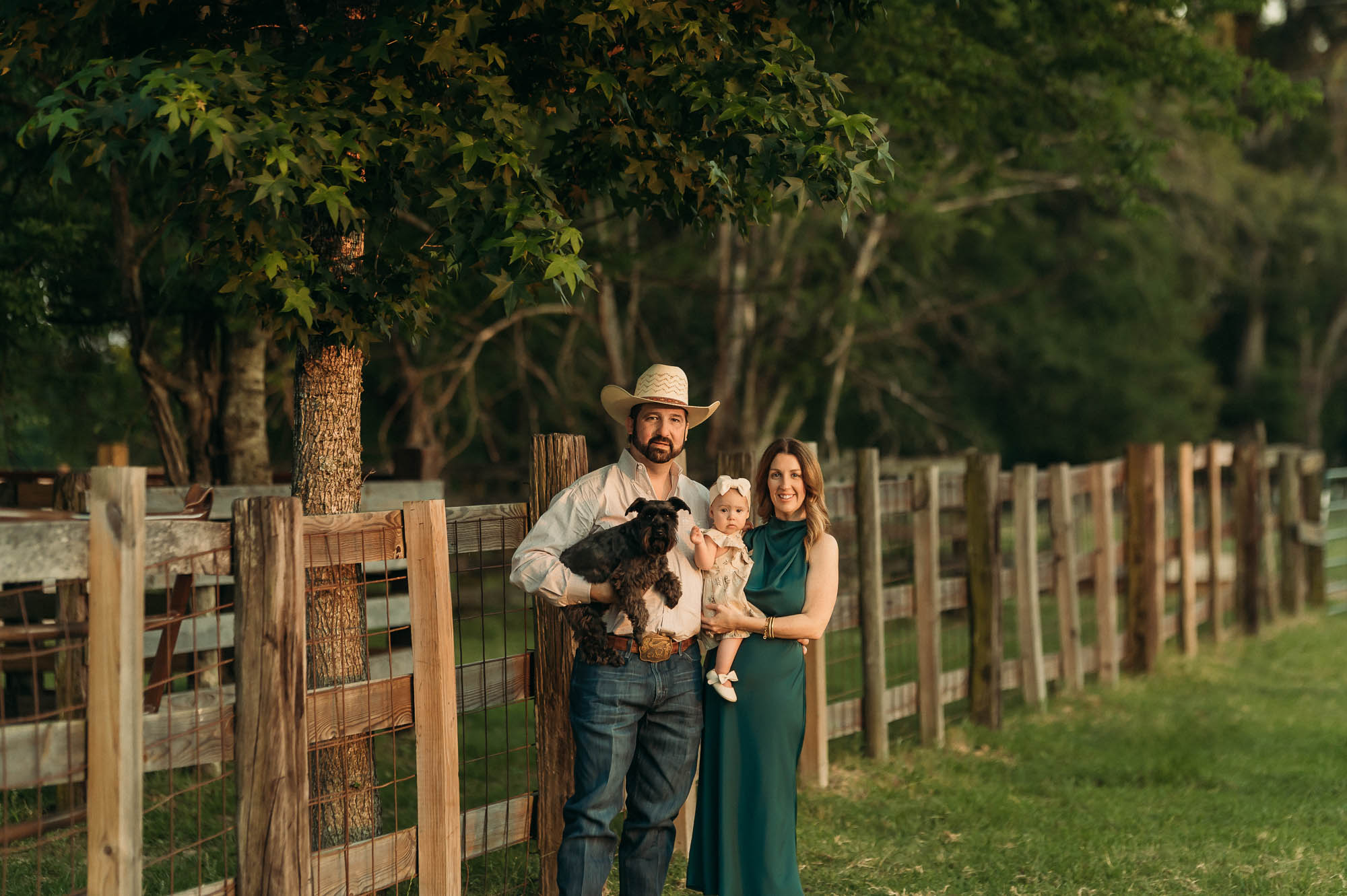 A Family Portrait by their cattle chute | East Texas Lifestyle Photographer