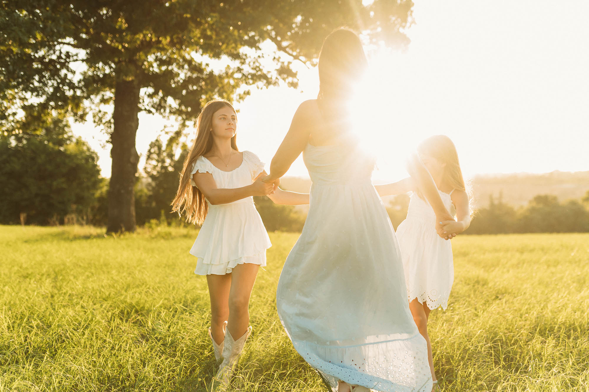 Mother and daughters playing in a meadow | Motherhood Photography Tyler TX