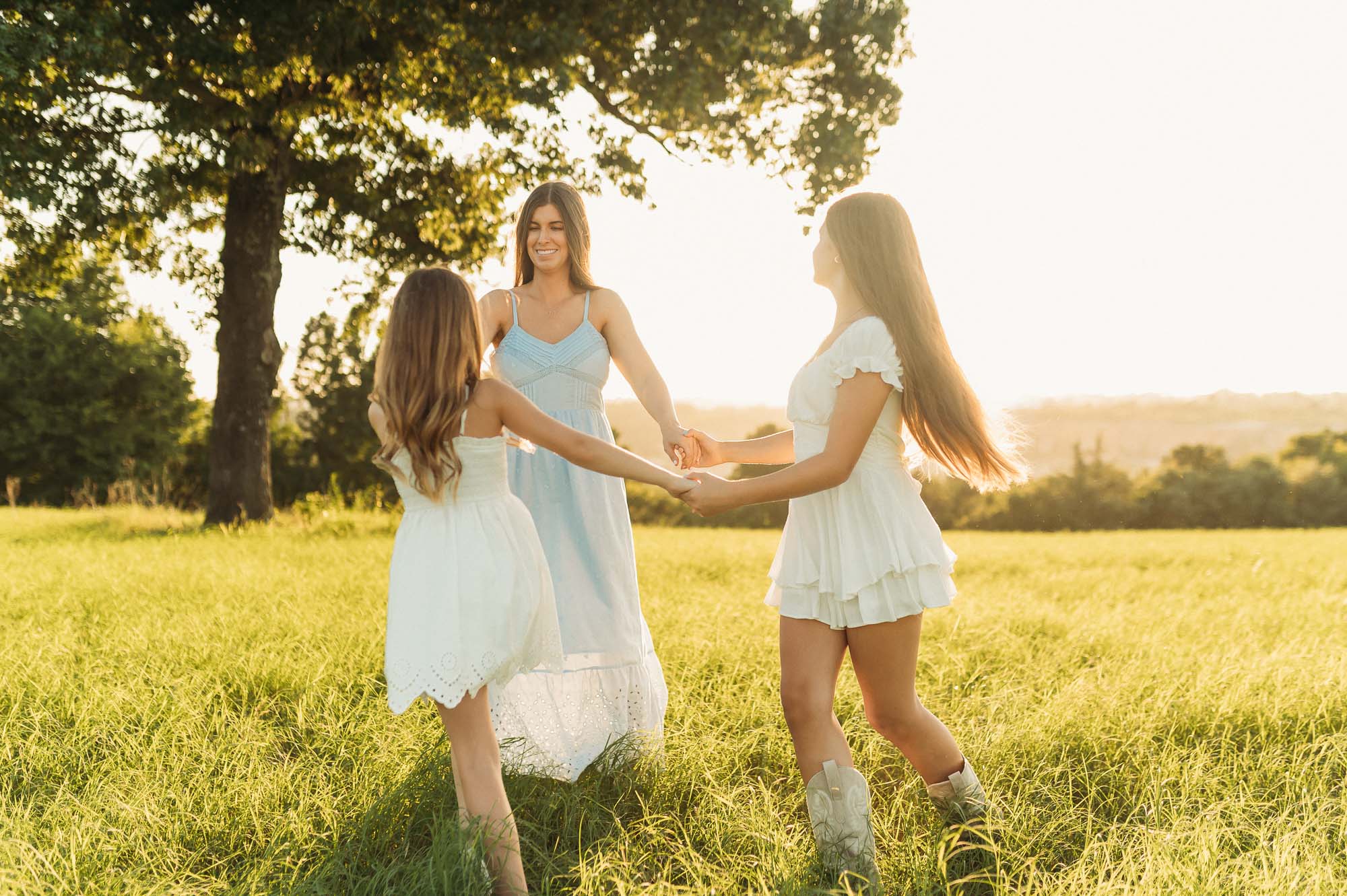 Mother and daughters playing in a meadow | Motherhood Photography Tyler TX