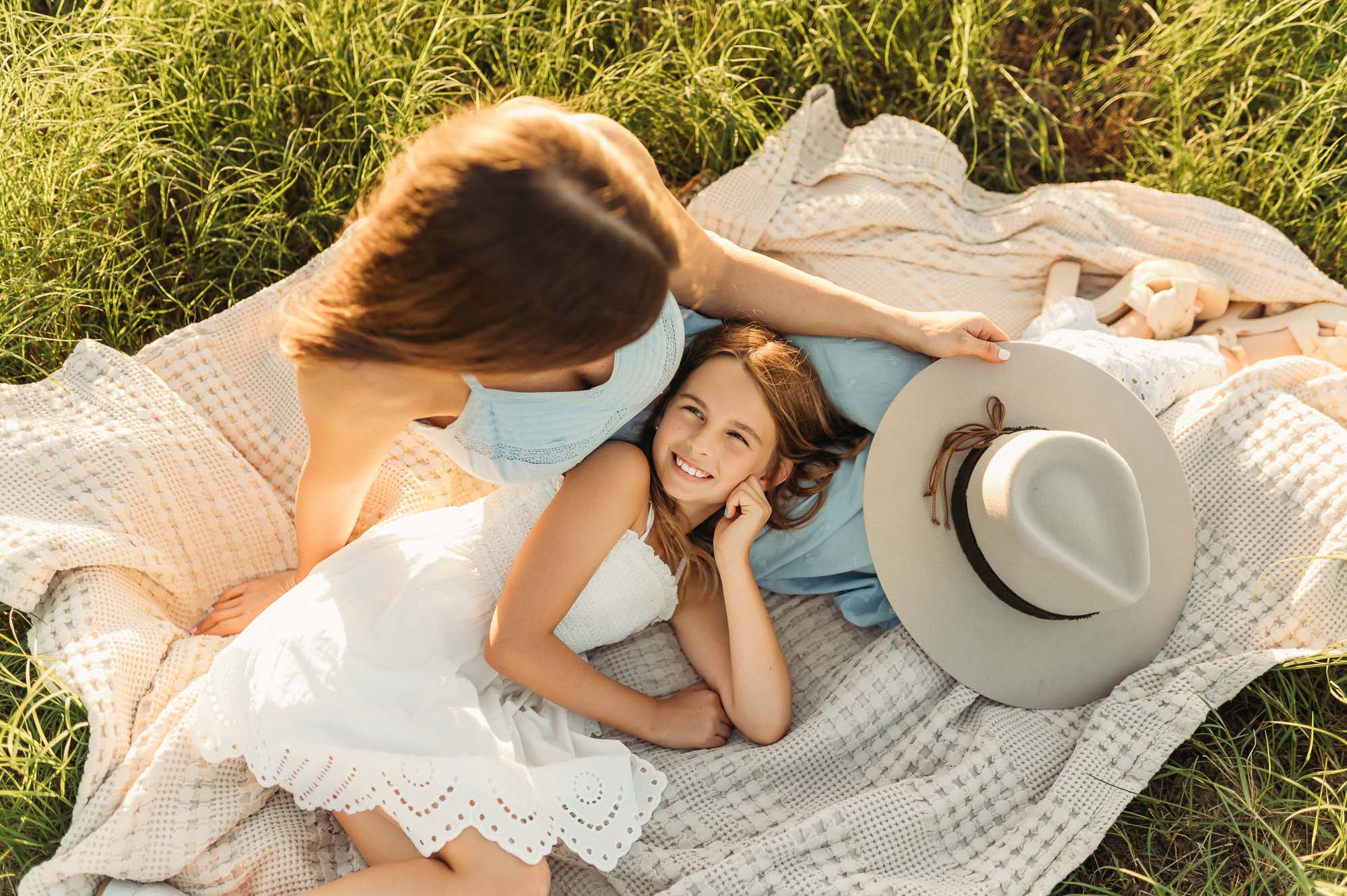 Mother and daughter laying on a blanket in meadow | Motherhood Photography Tyler TX