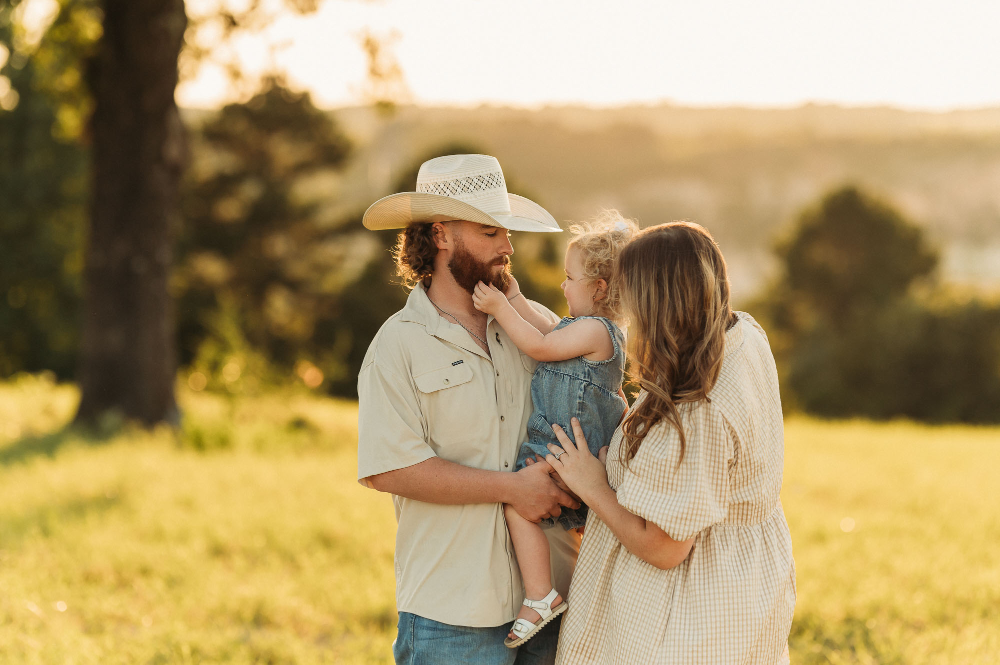 Portrait of Dad snuggling with family | East Texas Pregnancy Photographer