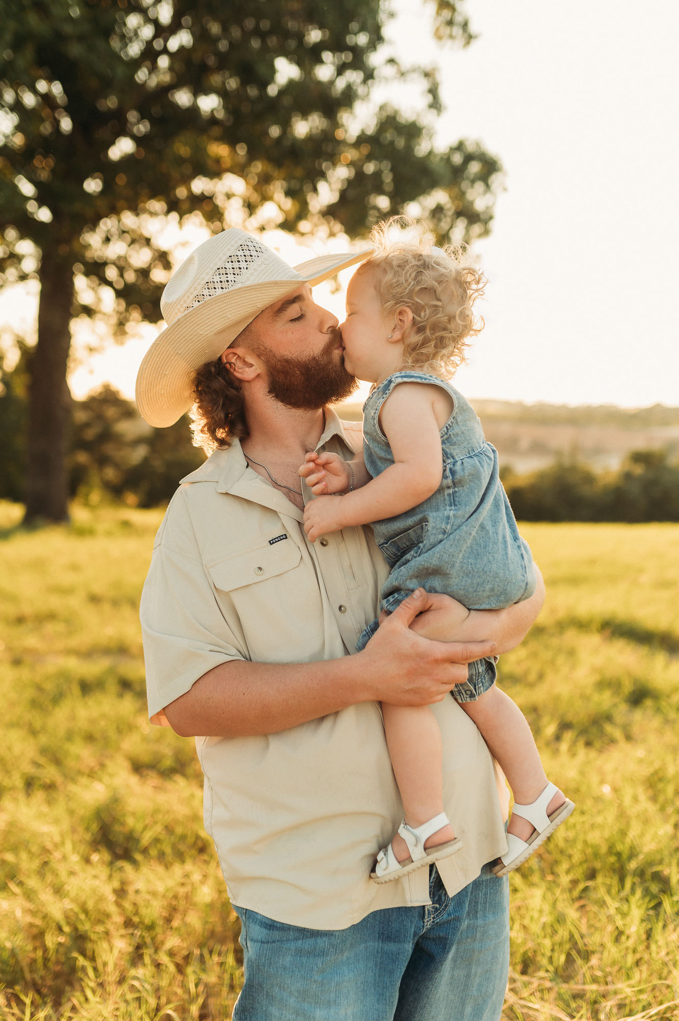Portrait of Dad snuggling with family | East Texas Pregnancy Photographer