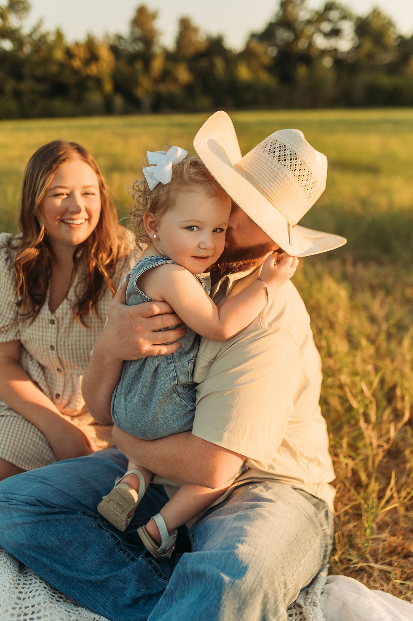 Portrait of Dad snuggling with family | East Texas Pregnancy Photographer