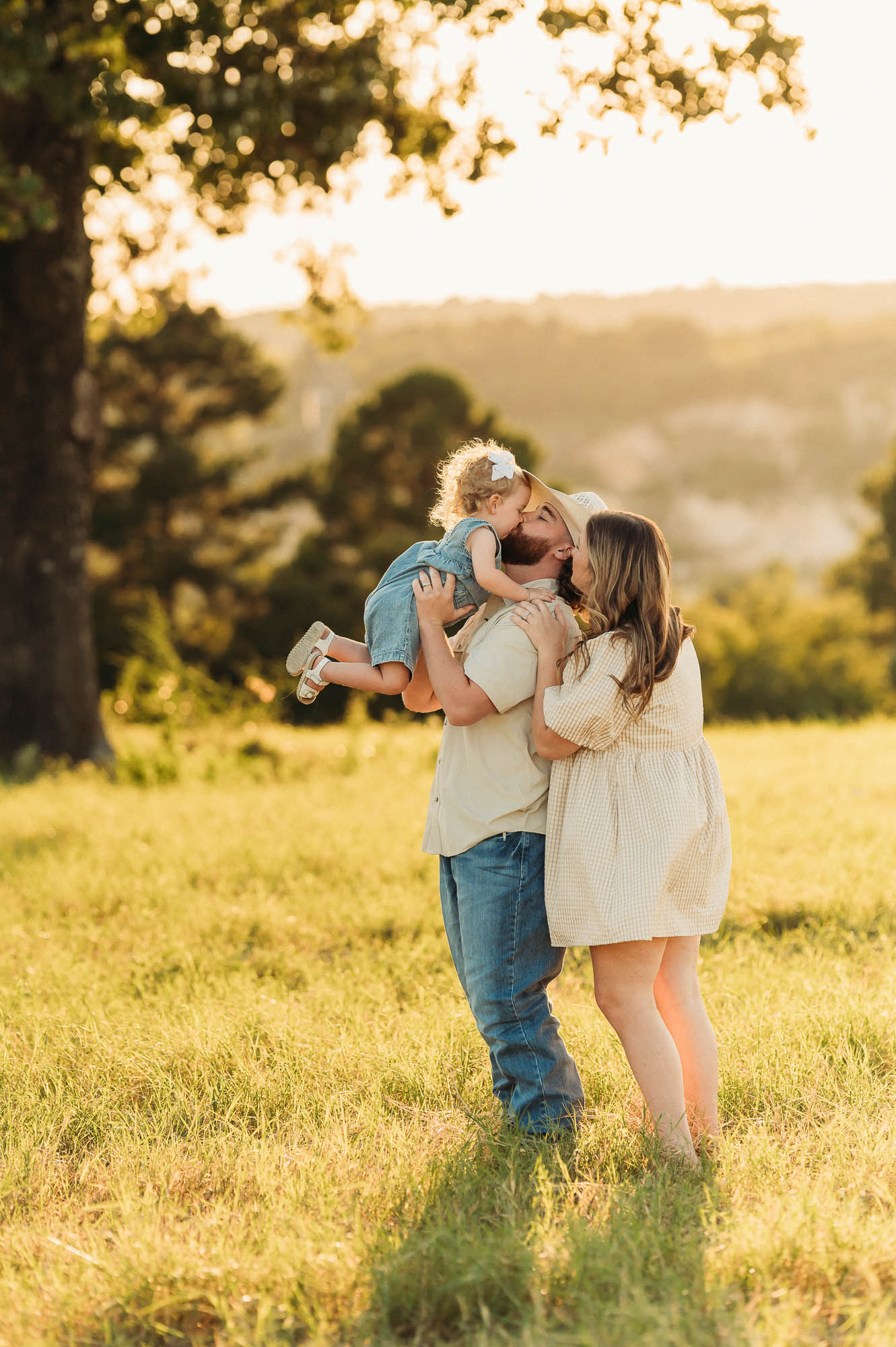 Portrait of Dad snuggling with family | East Texas Pregnancy Photographer