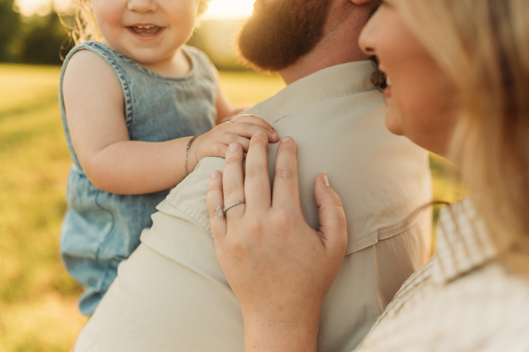 Portrait of Dad snuggling with family | East Texas Pregnancy Photographer