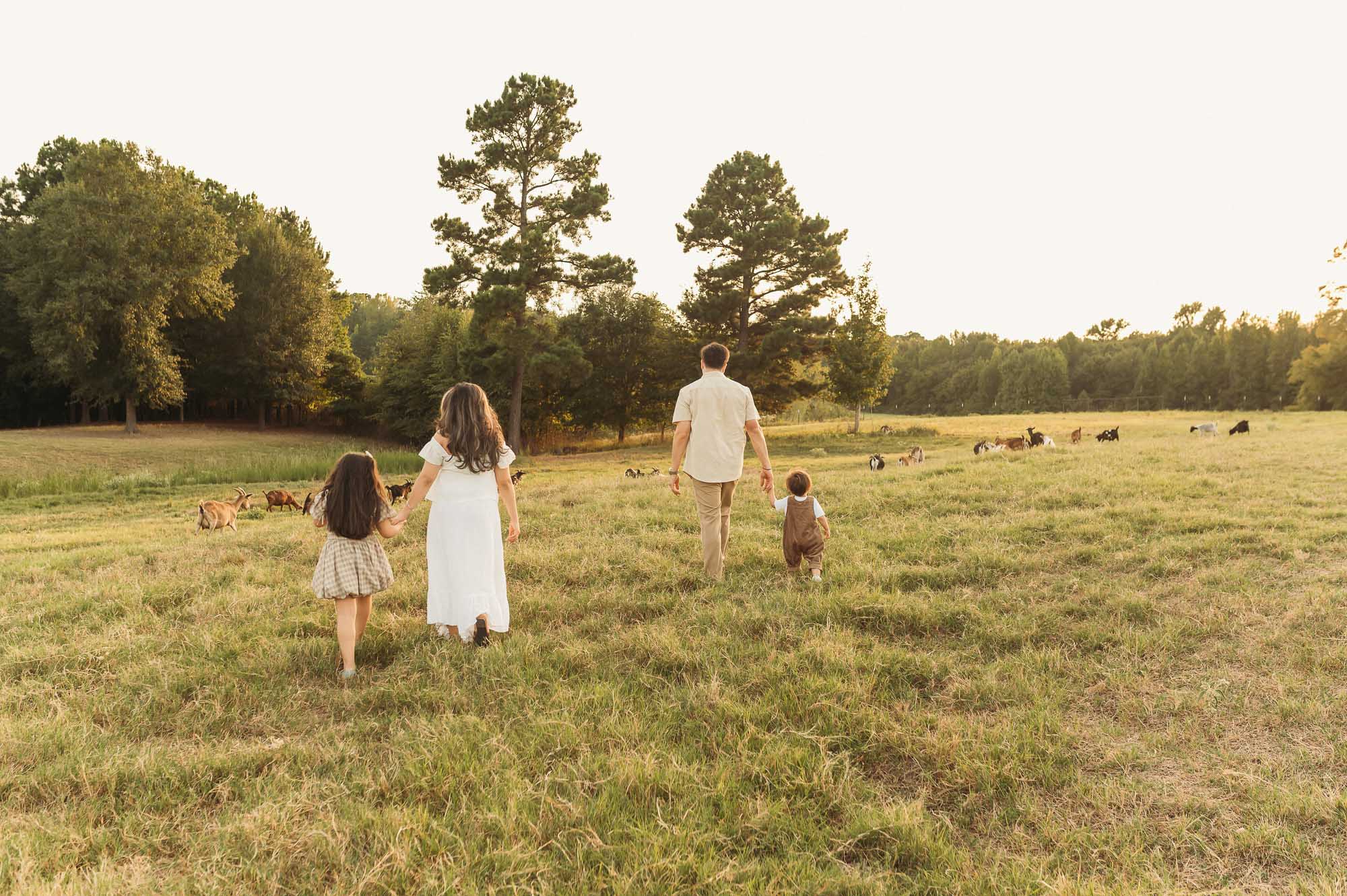 Family maternity portraits in a field at Flying H Ranch near Tyler Texas