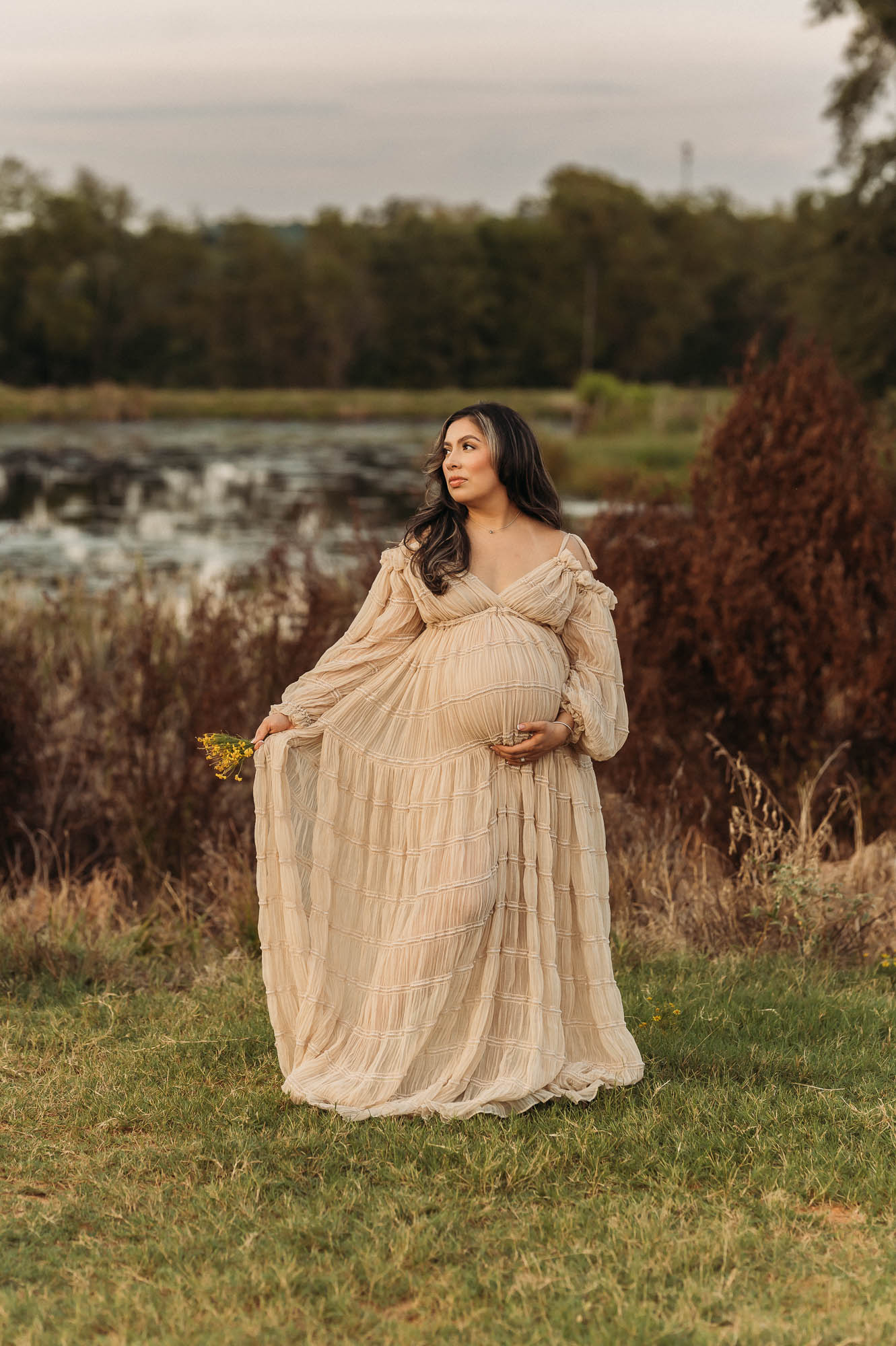 Expecting mother posing beside a pond during her Tyler Texas maternity session