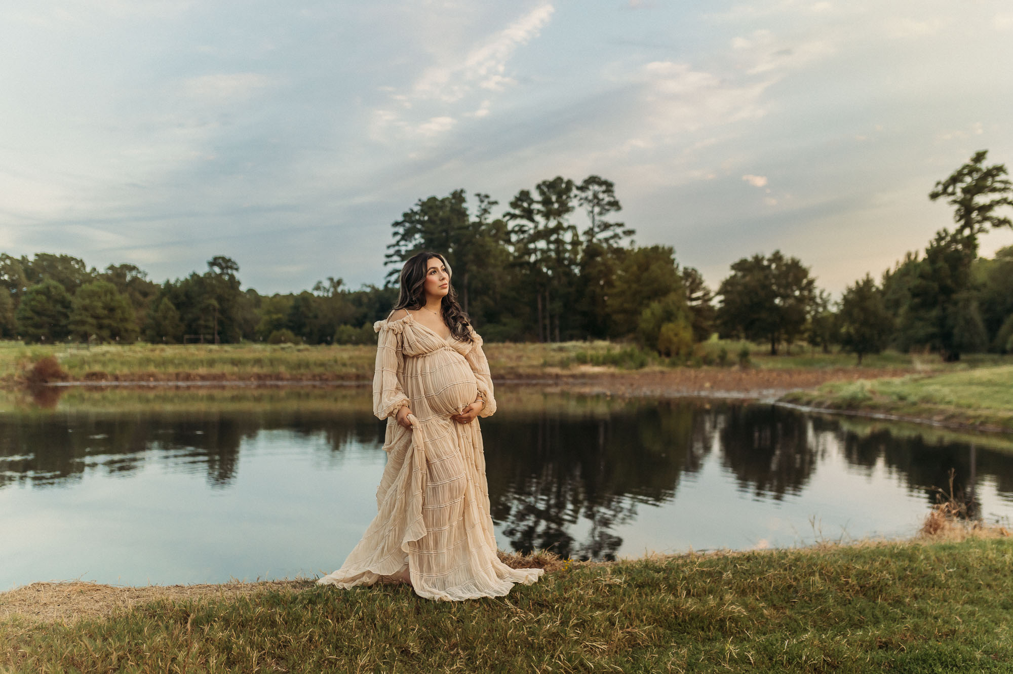 Expecting mother posing beside a pond during her Tyler Texas maternity session