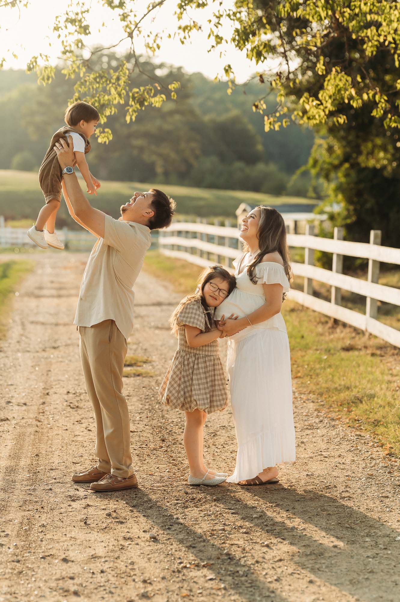 Family of four enjoying a maternity session at Flying H Ranch in Tyler Texas
